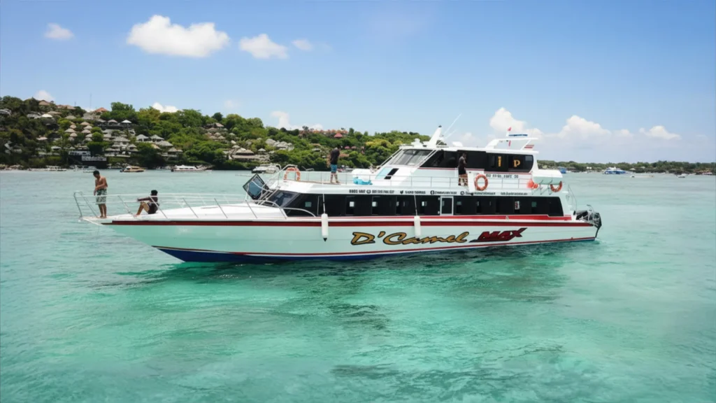 dcamel fast boat max anchored near the coastline, ready for passenger boarding from Nusa Lembongan.
