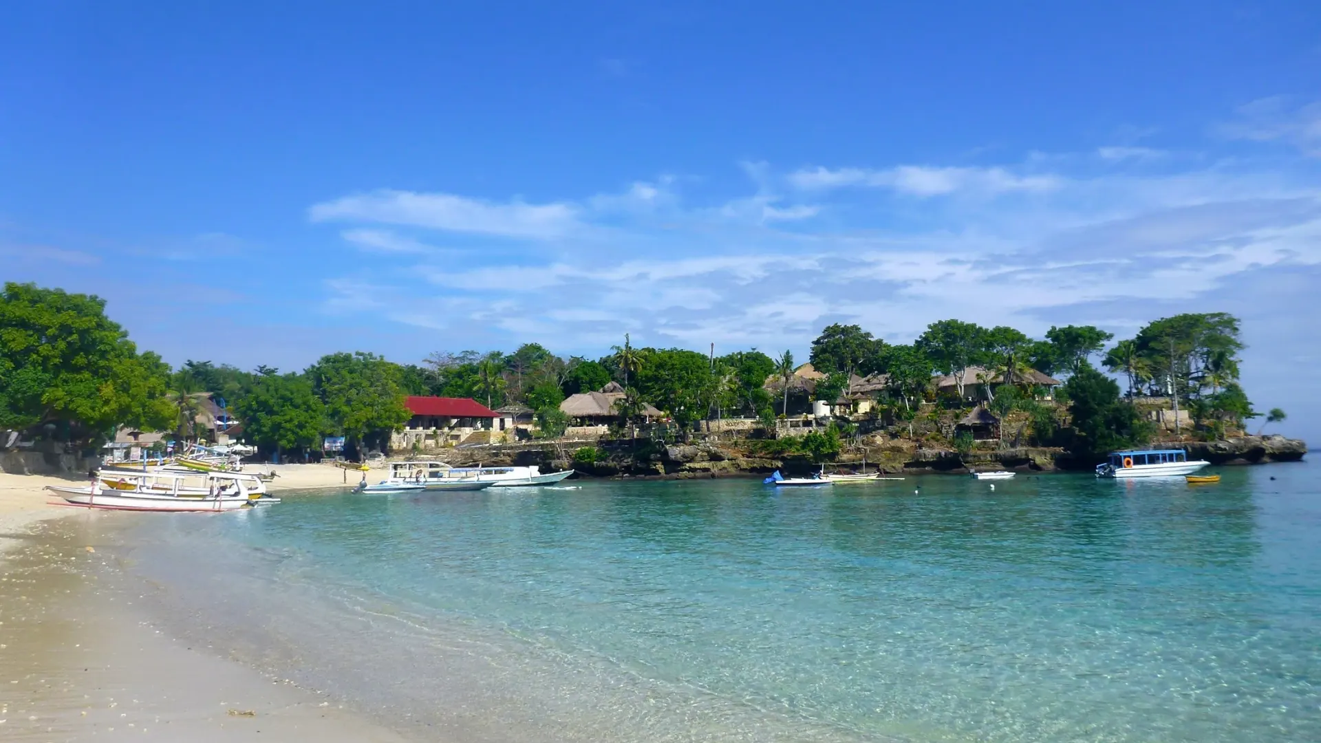 Safe, swimming-friendly waters and sandy shore lined with resorts at Mushroom Bay Nusa Lembongan.
