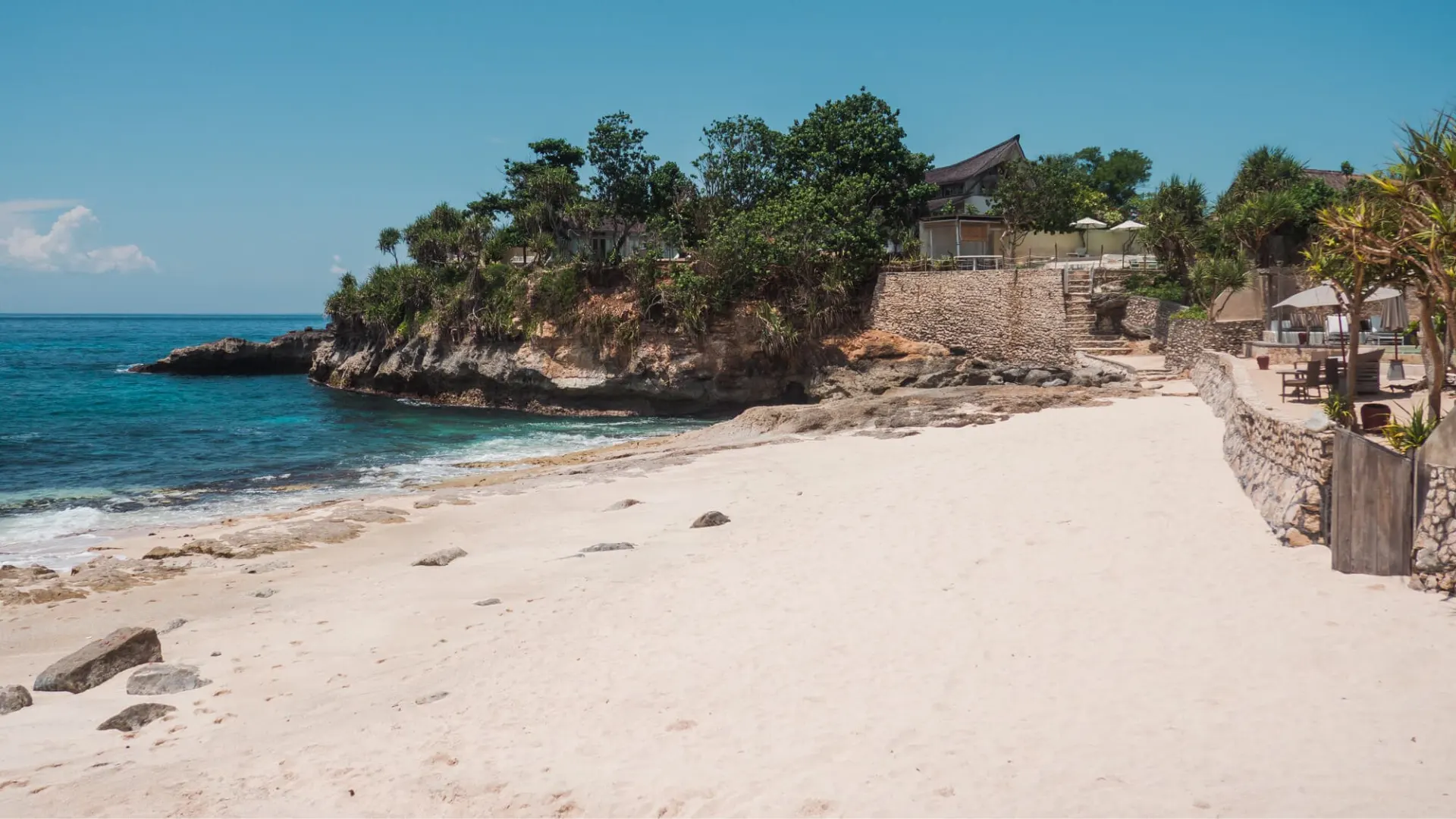 Tropical cliffside villa and private beach area adjacent to Sandy Bay Beach Club Nusa Lembongan.